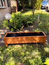 Classic 48-inch cedar patio planter photographed outdoors in a garden setting