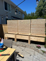 Three cedar privacy planters installed