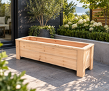 Empty slim cedar balcony planter on a landscaped patio