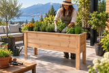 Woman tending vegetables in an elevated cedar garden bed