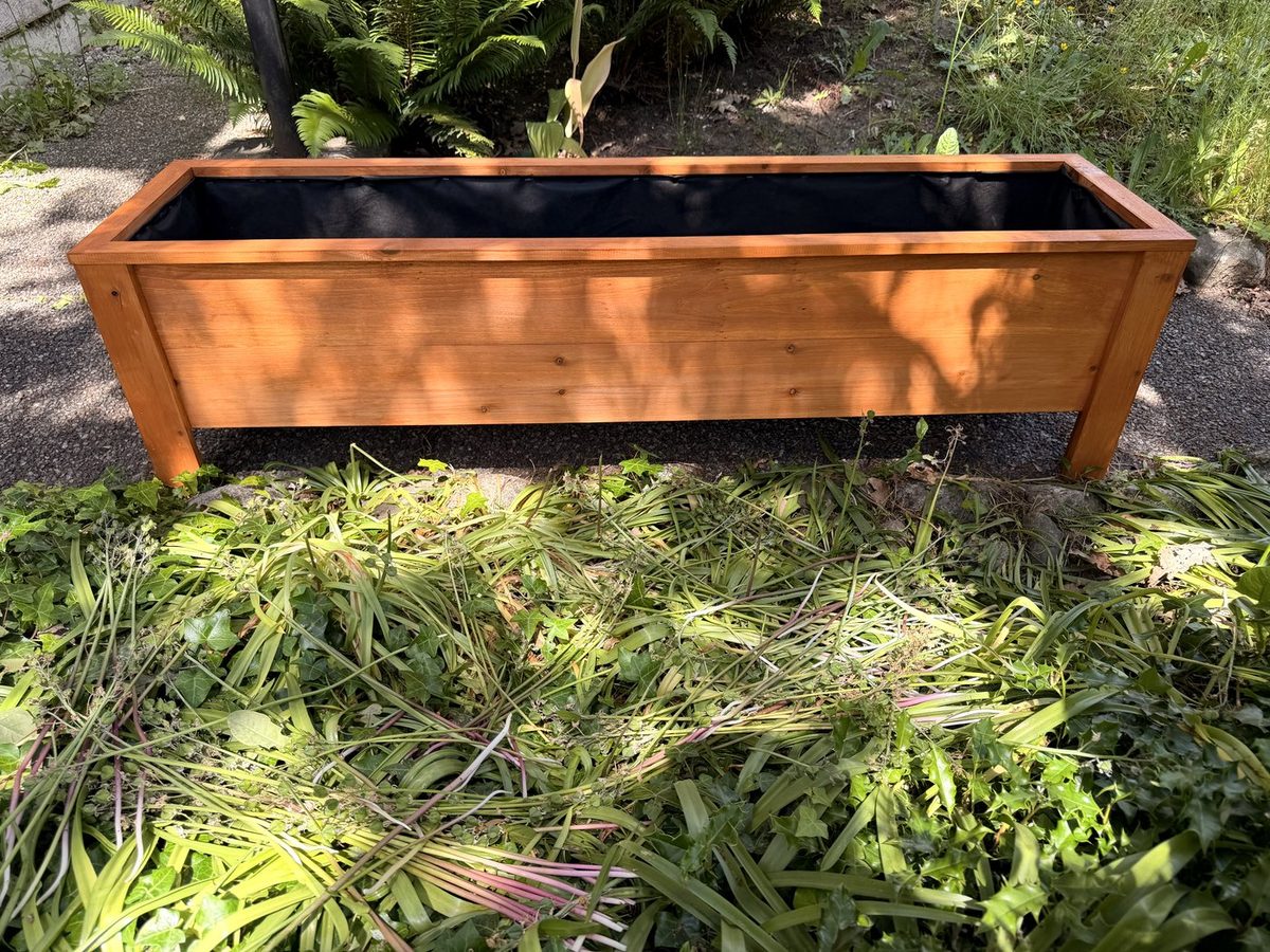 Finished stained cedar planter box with liner, hand-built by Coastline Cedar